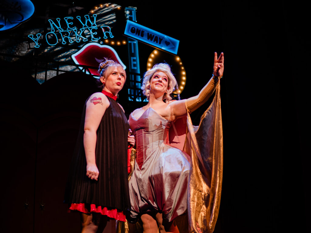 Sydney hoffman and Emily Barnett perform on stage in Sweet Charity