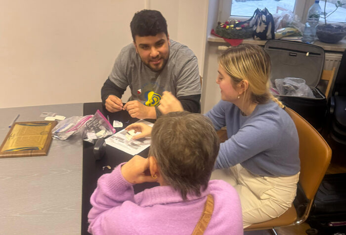 Matt Mascobetto works with two people