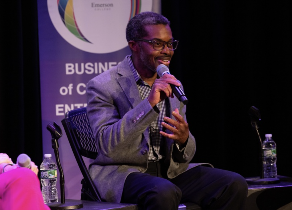 Brent Smith talks while holding a microphone