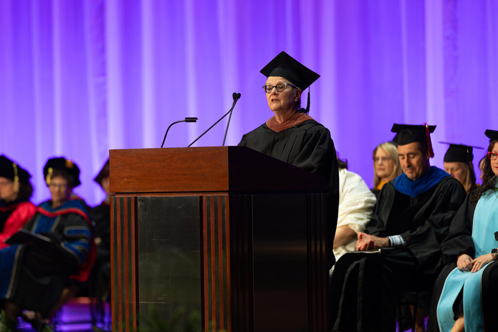 Jan Roberts-Breslin speaks at podium