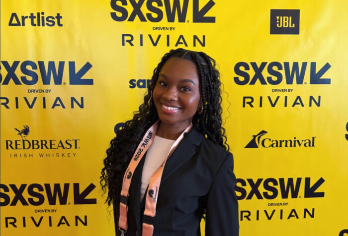 Nia Harmon in front of SXSW step and repeat
