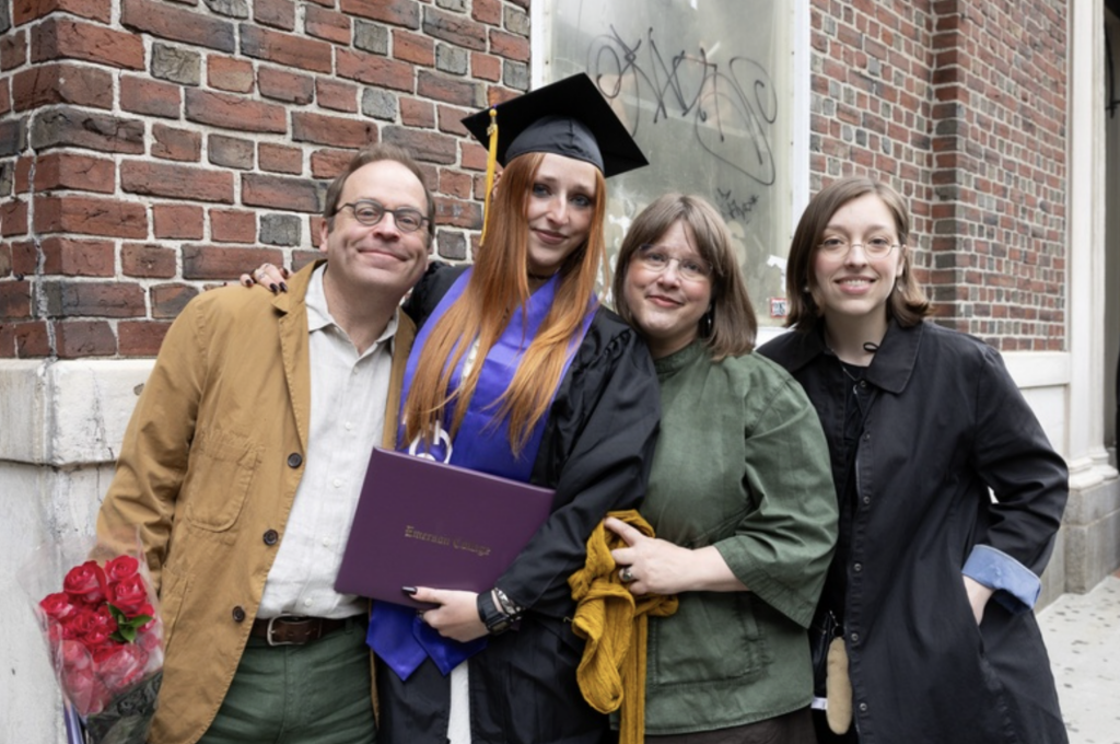 A graduate with three family members
