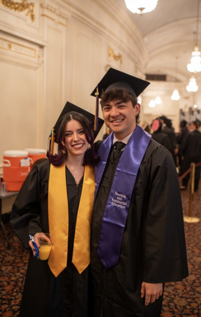 Two people pose for a photo