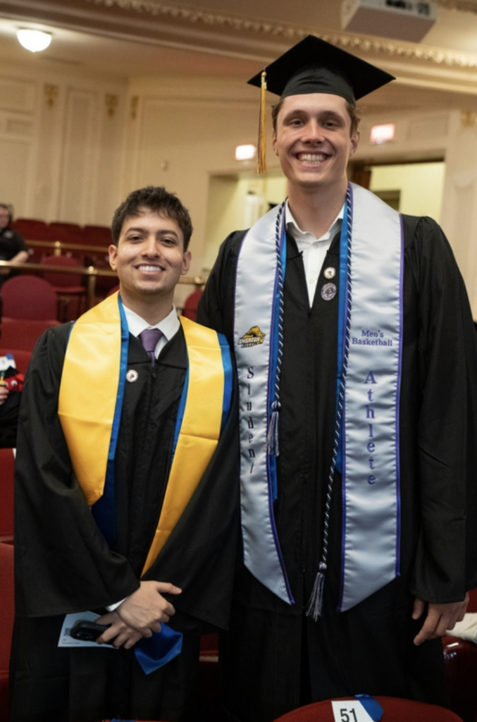 Two people stand for a photo