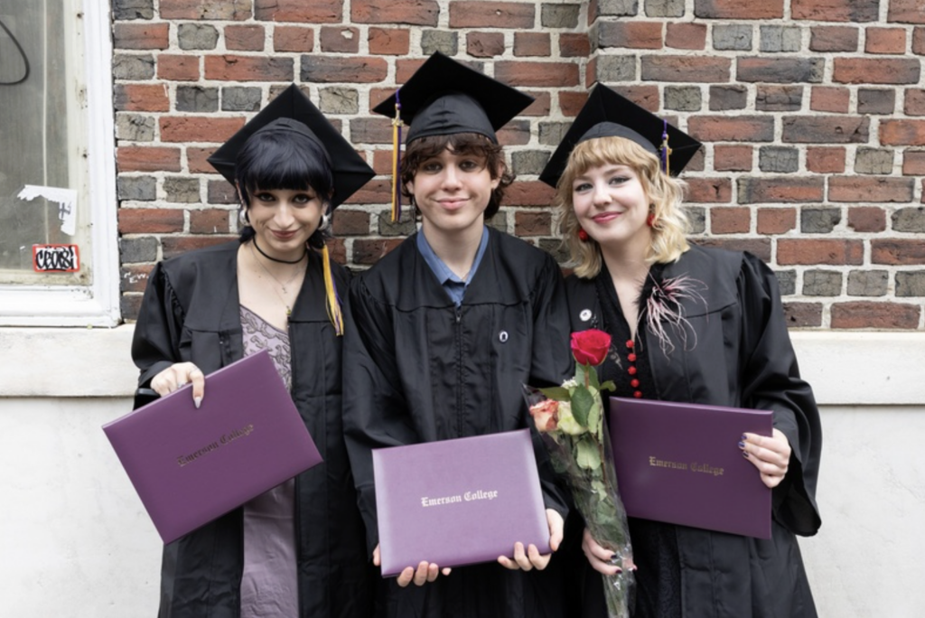 Three people pose for the camera