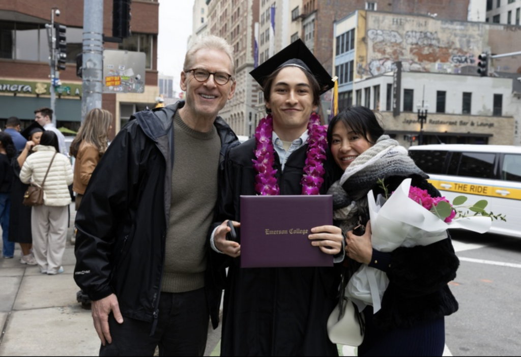 A graduate with their parents