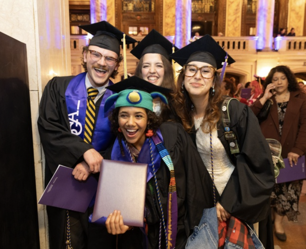 Four students pose for a photo