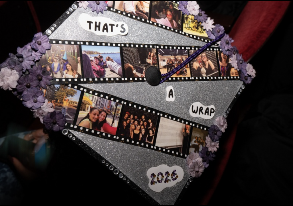 The mortar board of a cap has photos and says "That's a wrap 2026"