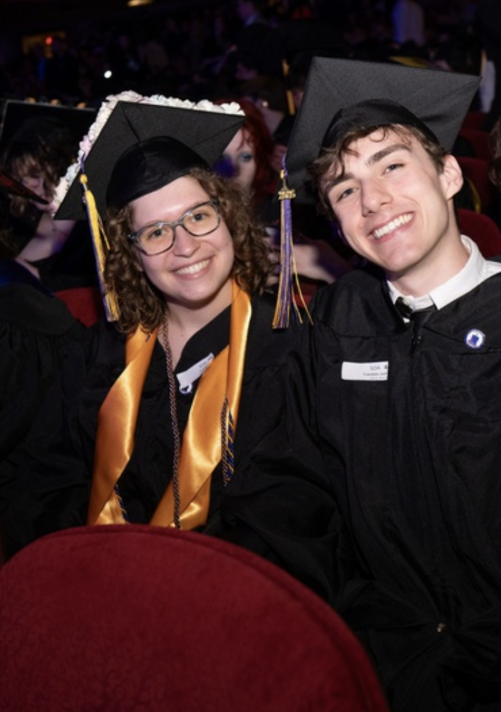 Two people pose for a photo