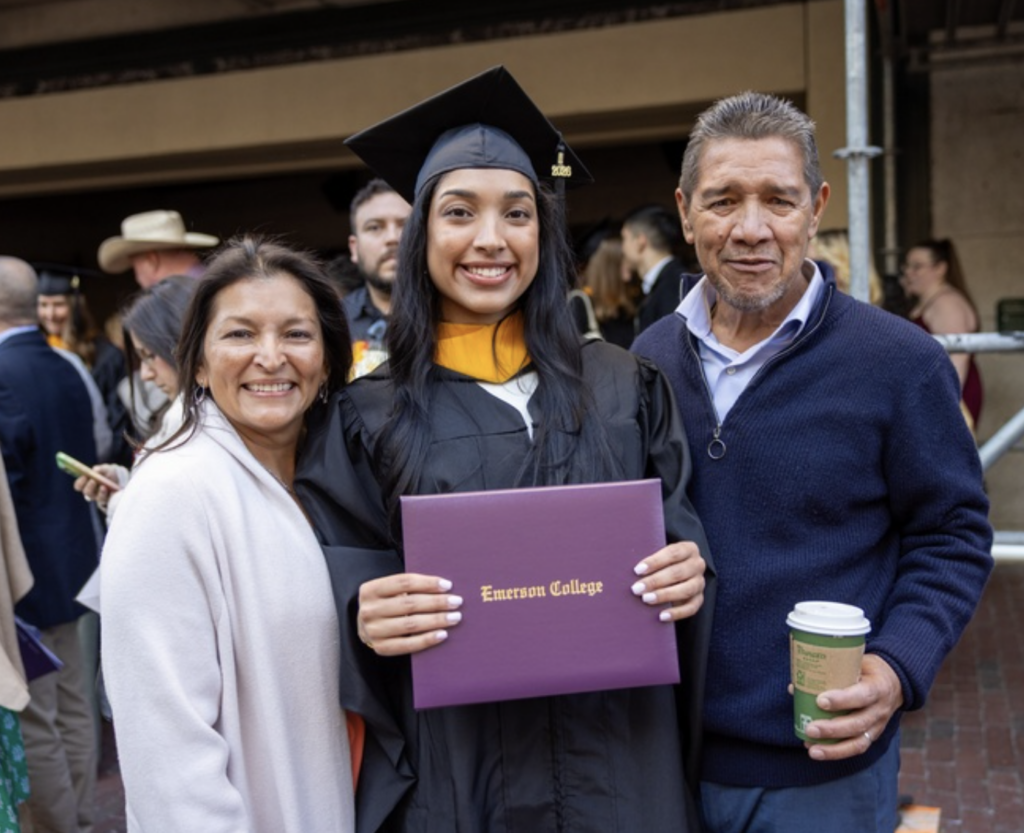 A graduate with two family members
