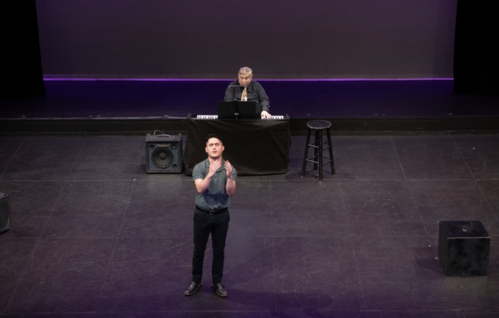 A man acts on stage