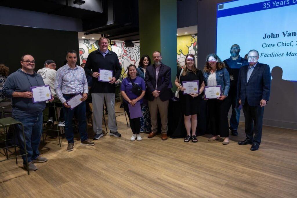 A group of people recognized for working at Emerson for 10 years