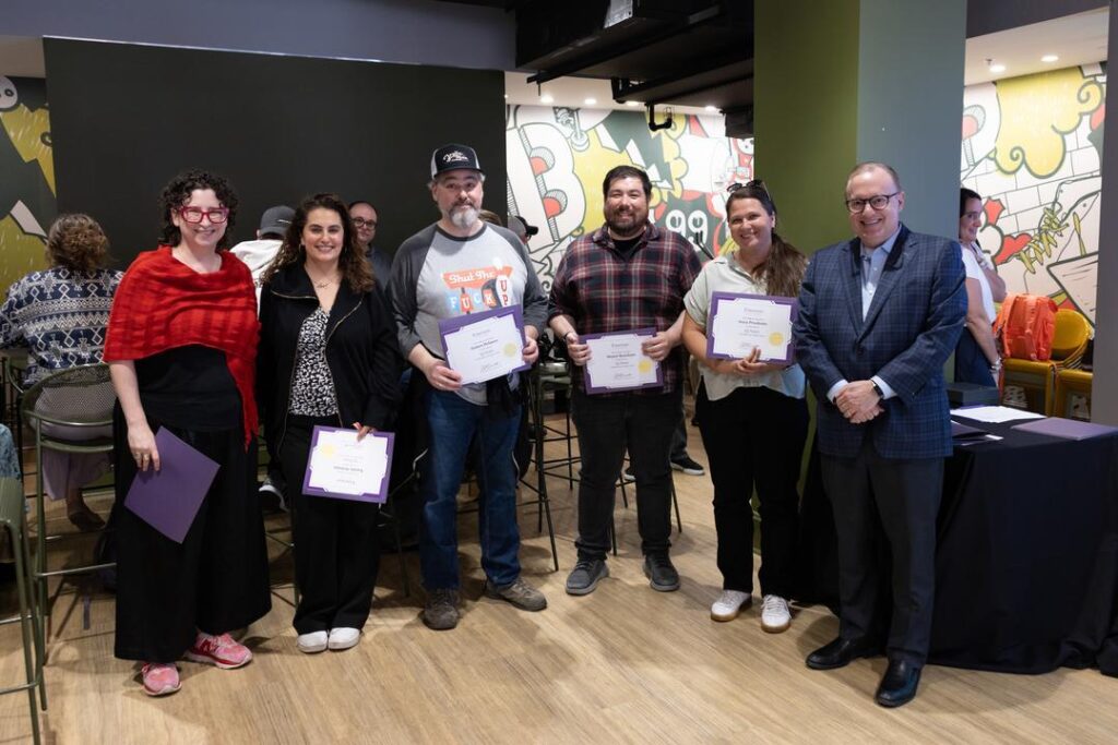 A group of people recognized for working at Emerson for 15 years