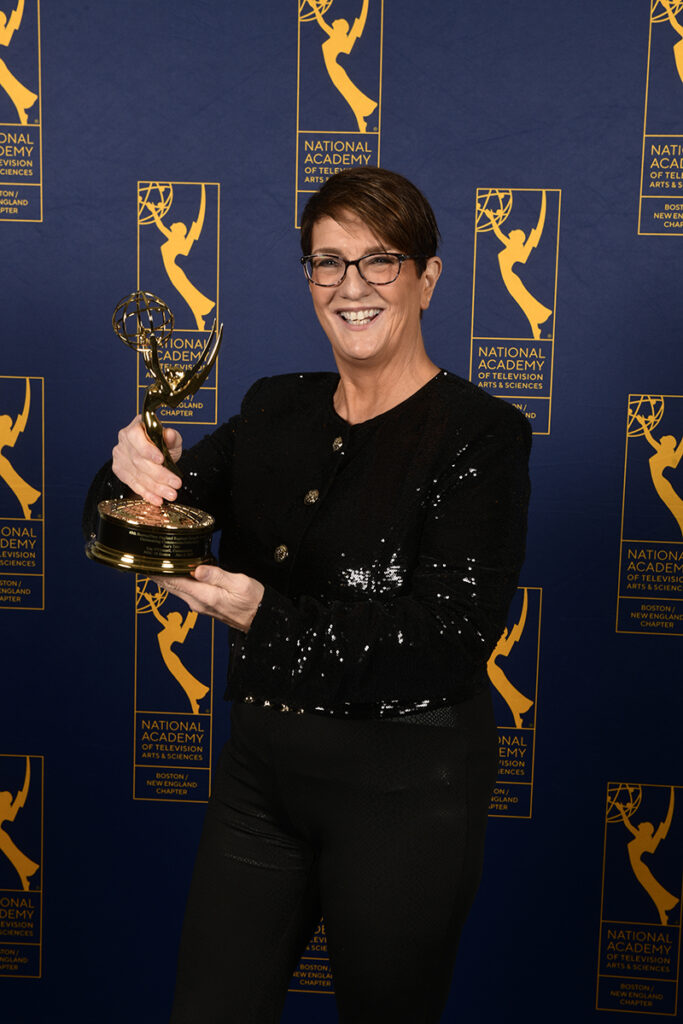 Sue O'Connell holds an Emmy