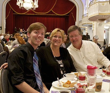 Student with his family on Family Weekend